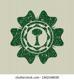 Green tree icon inside rubber seal