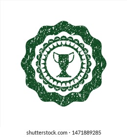 Green trophy icon inside distressed rubber grunge stamp