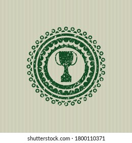 Green trophy icon inside distressed grunge seal. 