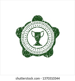 Green trophy icon inside grunge style stamp
