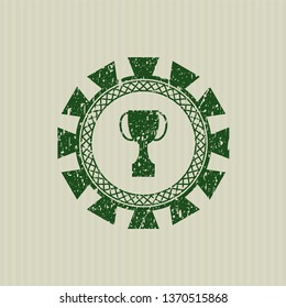 Green trophy icon inside grunge seal