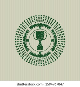 Green trophy icon inside grunge seal