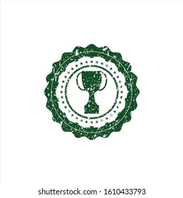 Green trophy icon inside grunge style stamp