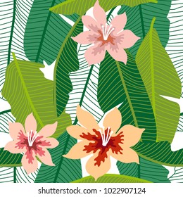 Green tropical background with banana leaves and flowers. Seamless botanical pattern with aloha motifs. Trendy design for textile, cards and invitations.