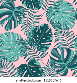 Green tropical leaves on pink background. Seamless pattern, vector design. Trendy summer Hawaii print. Beautiful seamless vector floral pattern. Summer background with exotic leaves.