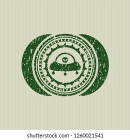 Green ufo with aline inside icon inside distressed rubber stamp with grunge texture