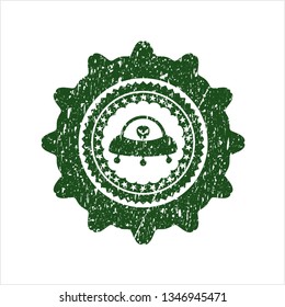 Green ufo with aline inside icon inside rubber stamp with grunge texture