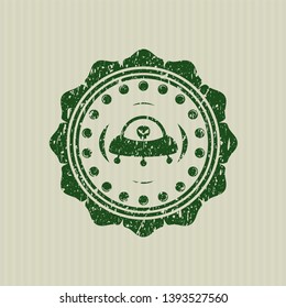 Green ufo with aline inside icon inside rubber texture