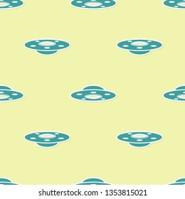 Green UFO flying spaceship icon isolated seamless pattern on yellow background. Flying saucer. Alien space ship. Futuristic unknown flying object. Flat design. Vector Illustration
