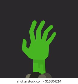 Green undead zombie hand raised up from the ground, isolated on dark background