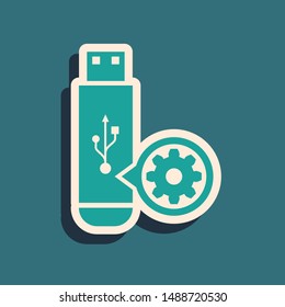 Green USB flash drive and gear icon isolated on blue background. Adjusting app, service concept, setting options, maintenance, repair, fixing. Long shadow style. Vector Illustration