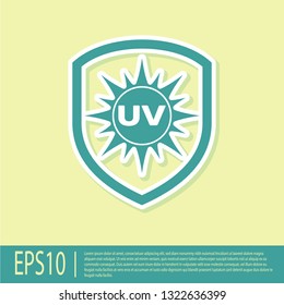 Green UV protection icon isolated on yellow background. Sun and shield. Ultra violet rays radiation. SPF sun sign. Flat design. Vector Illustration