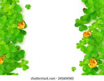 Green vector clovers with golden coins on white background