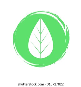 Green vector icon of a leaf. Silhouette on paint smudge background. 