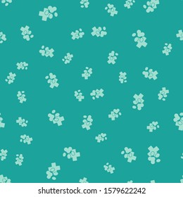 Green Veterinary clinic symbol icon isolated seamless pattern on green background. Cross hospital sign. Stylized paw print dog or cat. Pet First Aid sign.  Vector Illustration