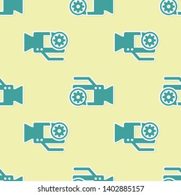Green Video camera and gear icon isolated seamless pattern on yellow background. Adjusting app, service concept, setting options, maintenance, repair, fixing. Vector Illustration