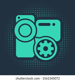 Green Video camera and gear icon isolated on blue background. Adjusting app, service concept, setting options, maintenance, repair, fixing. Abstract circle random dots. Vector Illustration