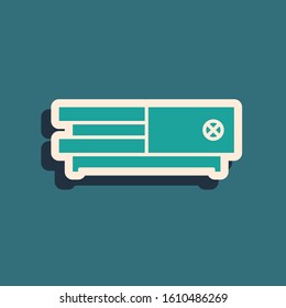 Green Video game console icon isolated on blue background. Long shadow style. Vector Illustration