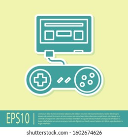 Green Video game console with joystick icon isolated on yellow background.  Vector Illustration
