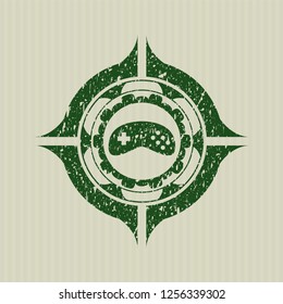 Green video game icon inside grunge stamp