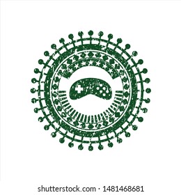Green video game icon inside grunge seal