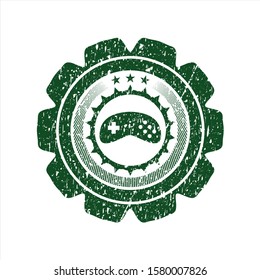 Green video game icon inside grunge stamp