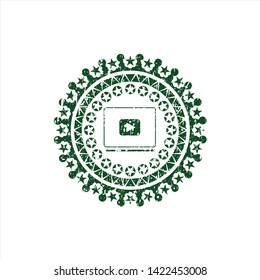 Green video player icon inside distressed rubber stamp