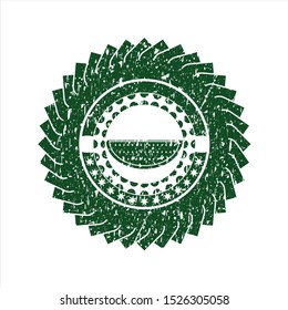 Green watermelon icon inside distressed rubber stamp with grunge texture