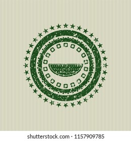 Green watermelon icon inside rubber grunge stamp