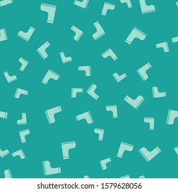 Green Waterproof rubber boot icon isolated seamless pattern on green background. Gumboots for rainy weather, fishing, gardening.  Vector Illustration
