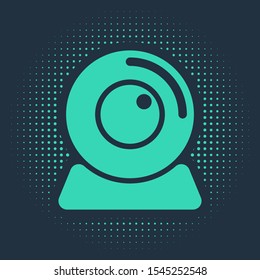 Green Web camera icon isolated on blue background. Chat camera. Webcam icon. Abstract circle random dots. Vector Illustration