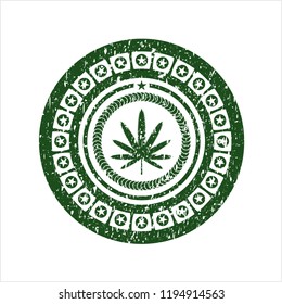 Green weed leaf icon inside distressed rubber grunge texture seal