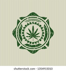 Green weed leaf icon inside distress grunge seal