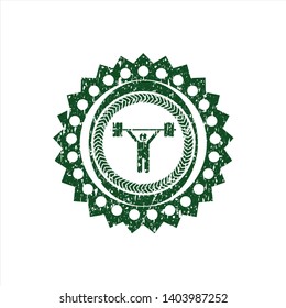 Green weightlifting icon inside rubber grunge texture seal