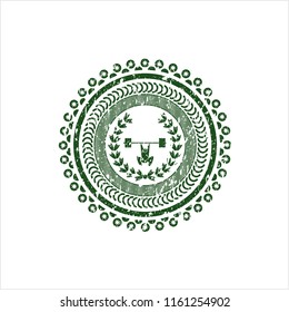 Green weightlifting inside of crown icon inside distressed rubber stamp