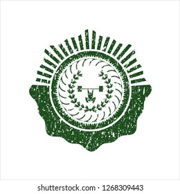 Green weightlifting inside of crown icon inside distressed grunge stamp