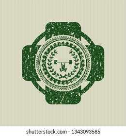 Green weightlifting inside of crown icon inside grunge seal