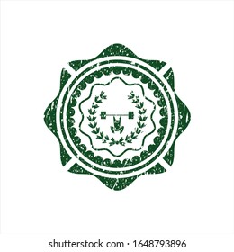 Levantamiento de pesas verde dentro del icono de la corona dentro del retén de caucho del peligro