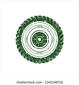 Green weightlifting or powerlifting plate (45 lbs) icon inside distressed grunge seal