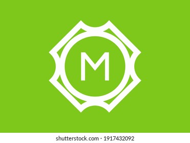 Blanco verde de la letra inicial de M en el diseño del marco