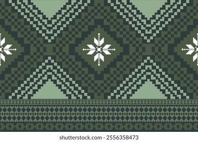 A green and white patterned fabric with a diamond shape in the middle. The diamond is surrounded by snowflakes