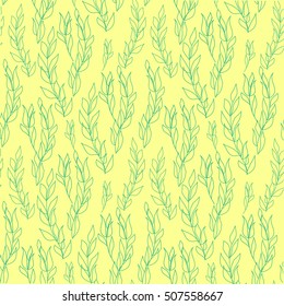 Green willow branches on yellow background