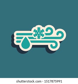 Green Wind and rain with snow icon isolated on blue background. Windy weather. Long shadow style. Vector Illustration