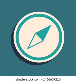 Green Wind rose icon isolated on blue background. Compass icon for travel. Navigation design. Long shadow style. Vector Illustration