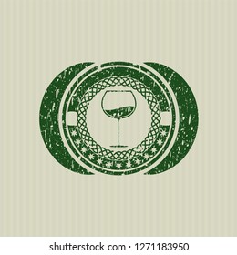 Green wine cup icon inside rubber grunge texture seal