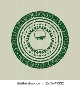 Green wine cup icon inside grunge seal