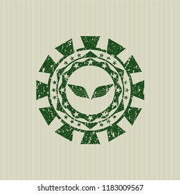 Green wings icon inside rubber stamp