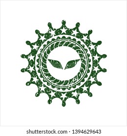 Green wings icon inside rubber stamp with grunge texture