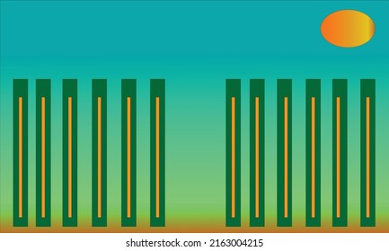 green and yellow bamboo fence with view of blue sky and sunshine