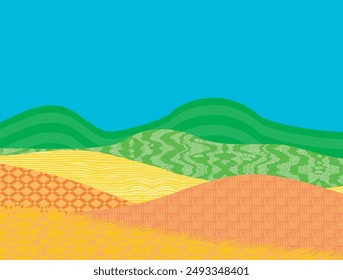 Campos verdes, amarillos y naranjas y colinas con cielo azul. campos con diferentes texturas.
